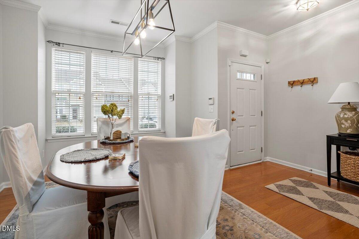 5349 Silver Moon Lane Raleigh, NC 27606 - Photo 8 of 41 a living room with furniture and a table