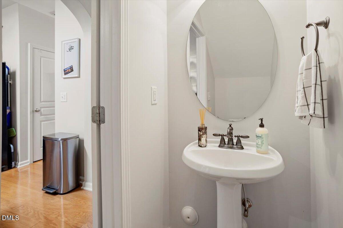 5349 Silver Moon Lane Raleigh, NC 27606 - Photo 9 of 41 a bathroom with a sink and a mirror