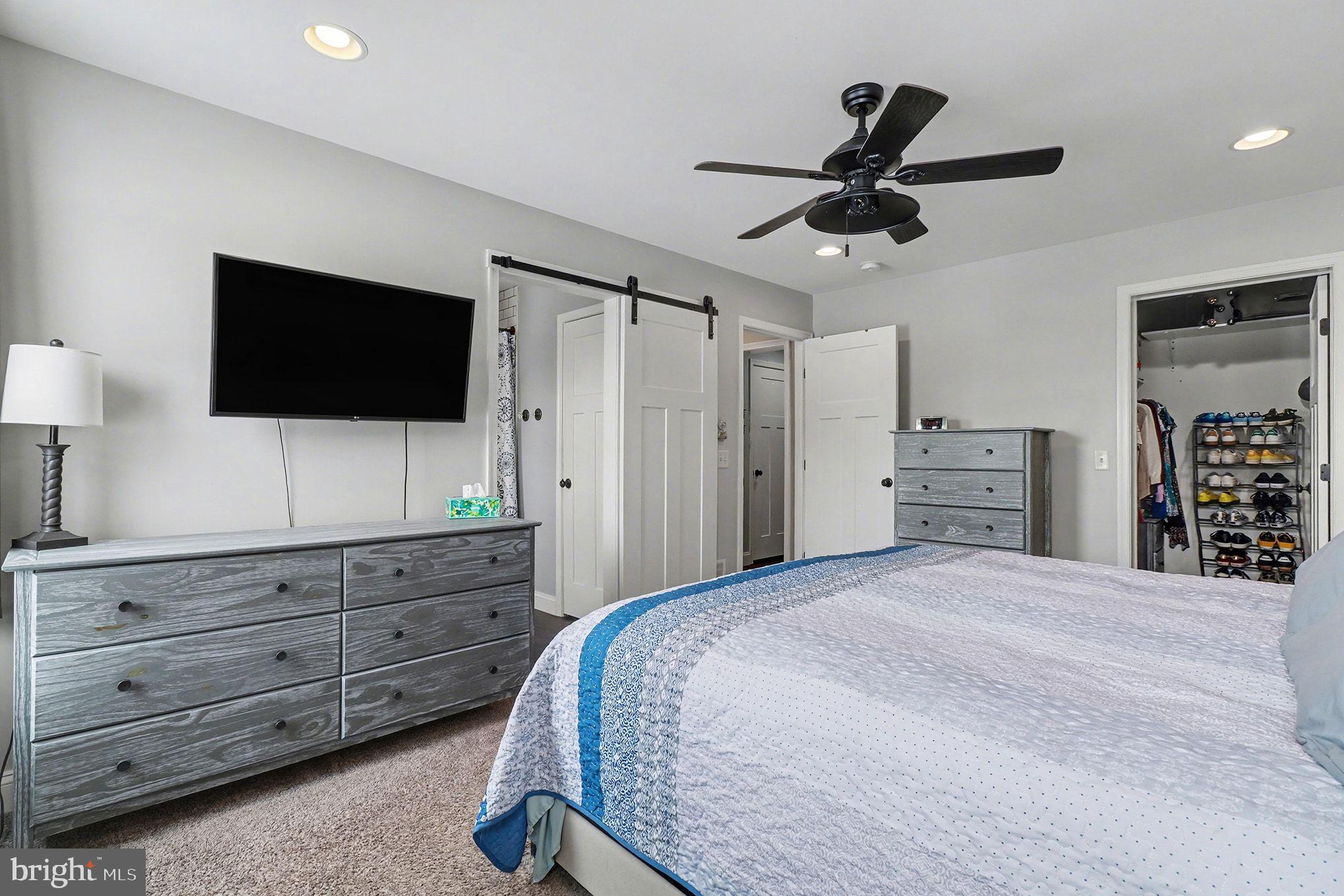 467 Hamilton Court Manheim, PA 17545 - Photo 31 of 48 a bedroom with a bed a flat screen tv and a dresser