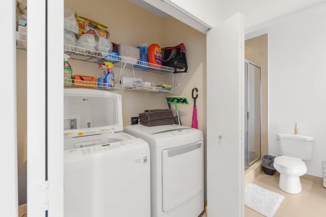 a utility room with dryer and washer