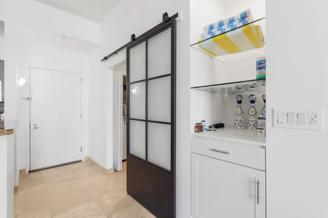 a kitchen with a refrigerator and a stove