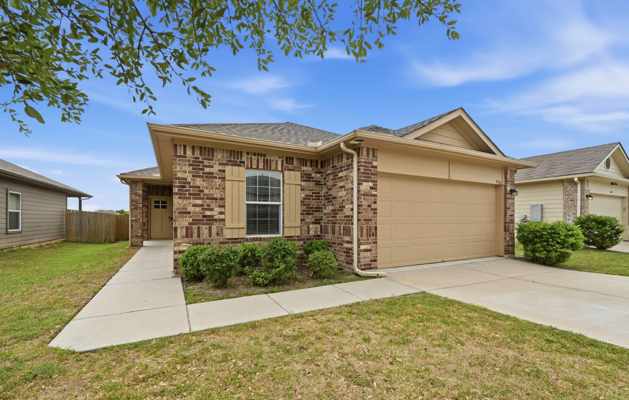 front view of a house with a yard