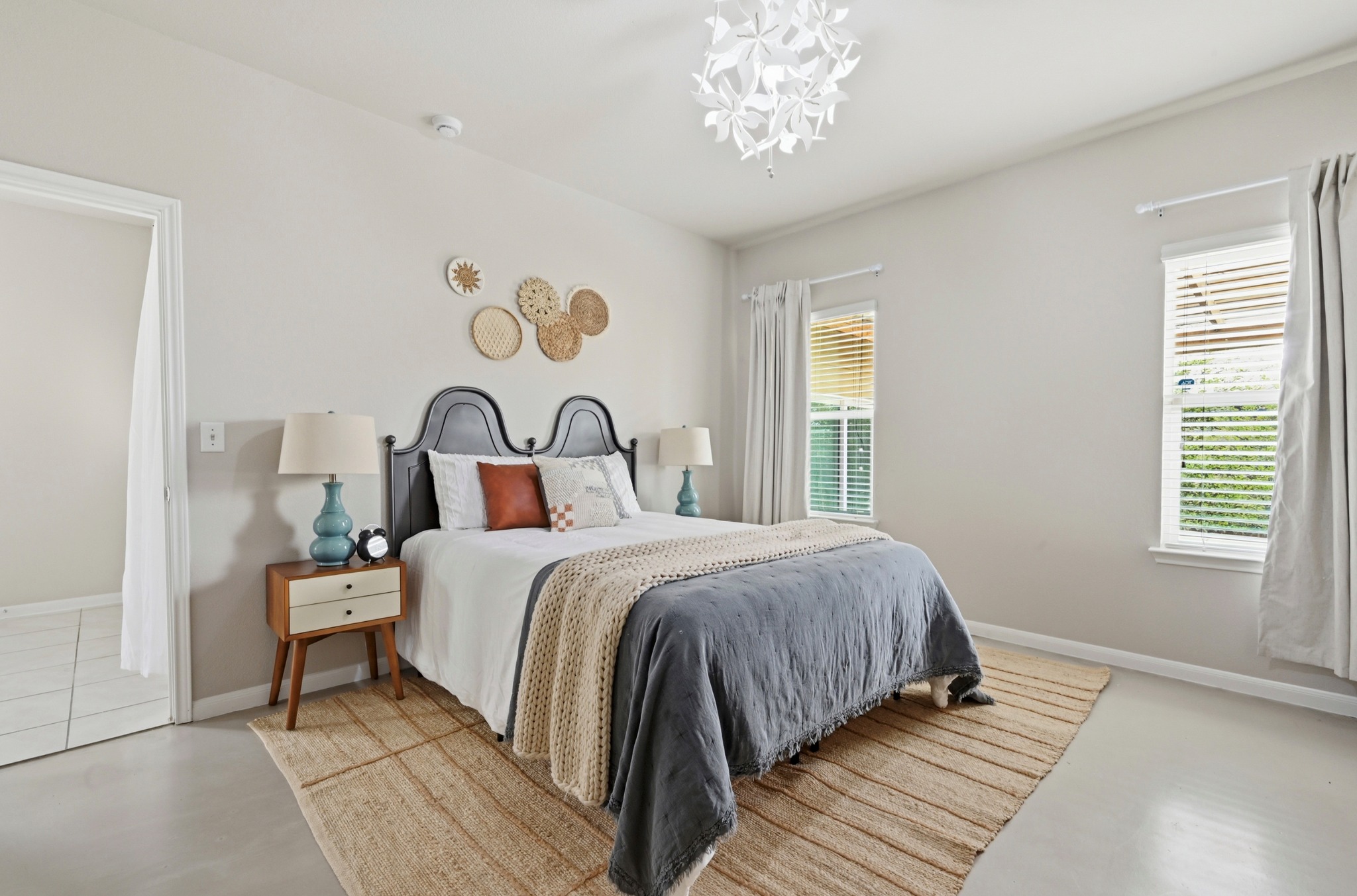 9716 Baden Lane Austin, TX 78754 - Photo 17 of 30 a bedroom with a bed and a window