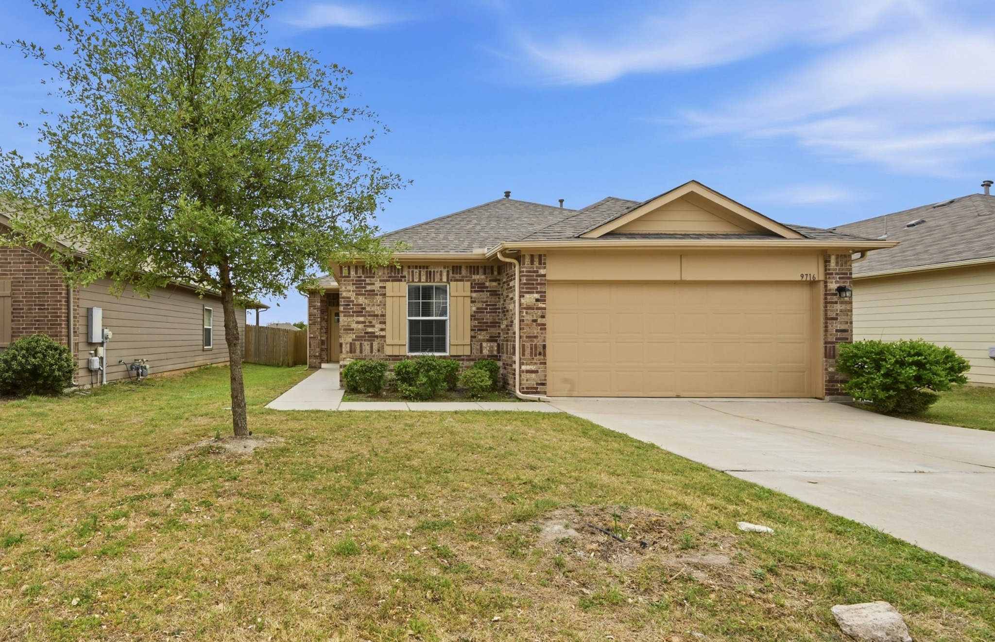 9716 Baden Lane Austin, TX 78754 - Photo 2 of 30 a front view of a house with a yard