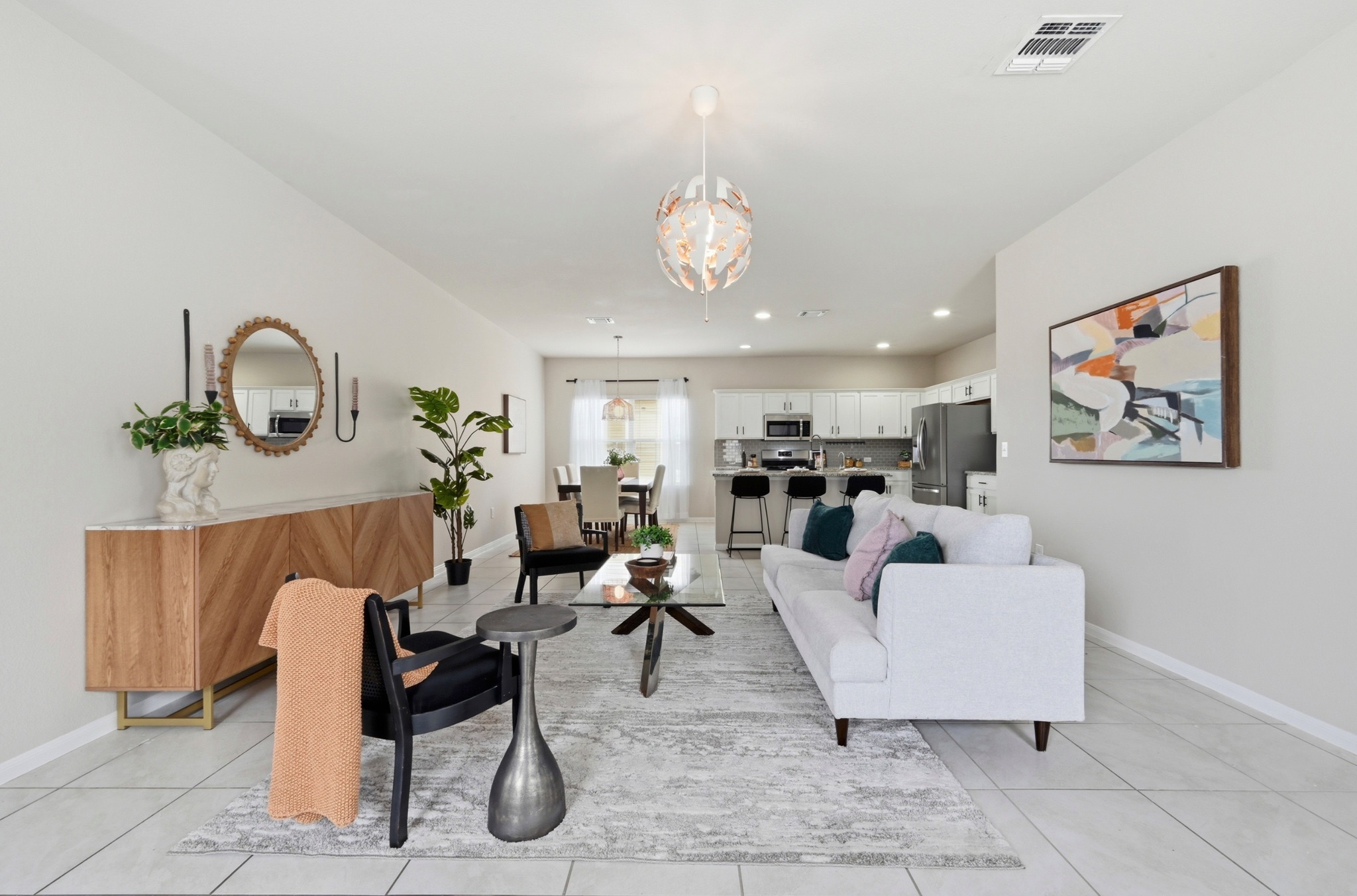 9716 Baden Lane Austin, TX 78754 - Photo 6 of 30 a living room with furniture a rug and white walls