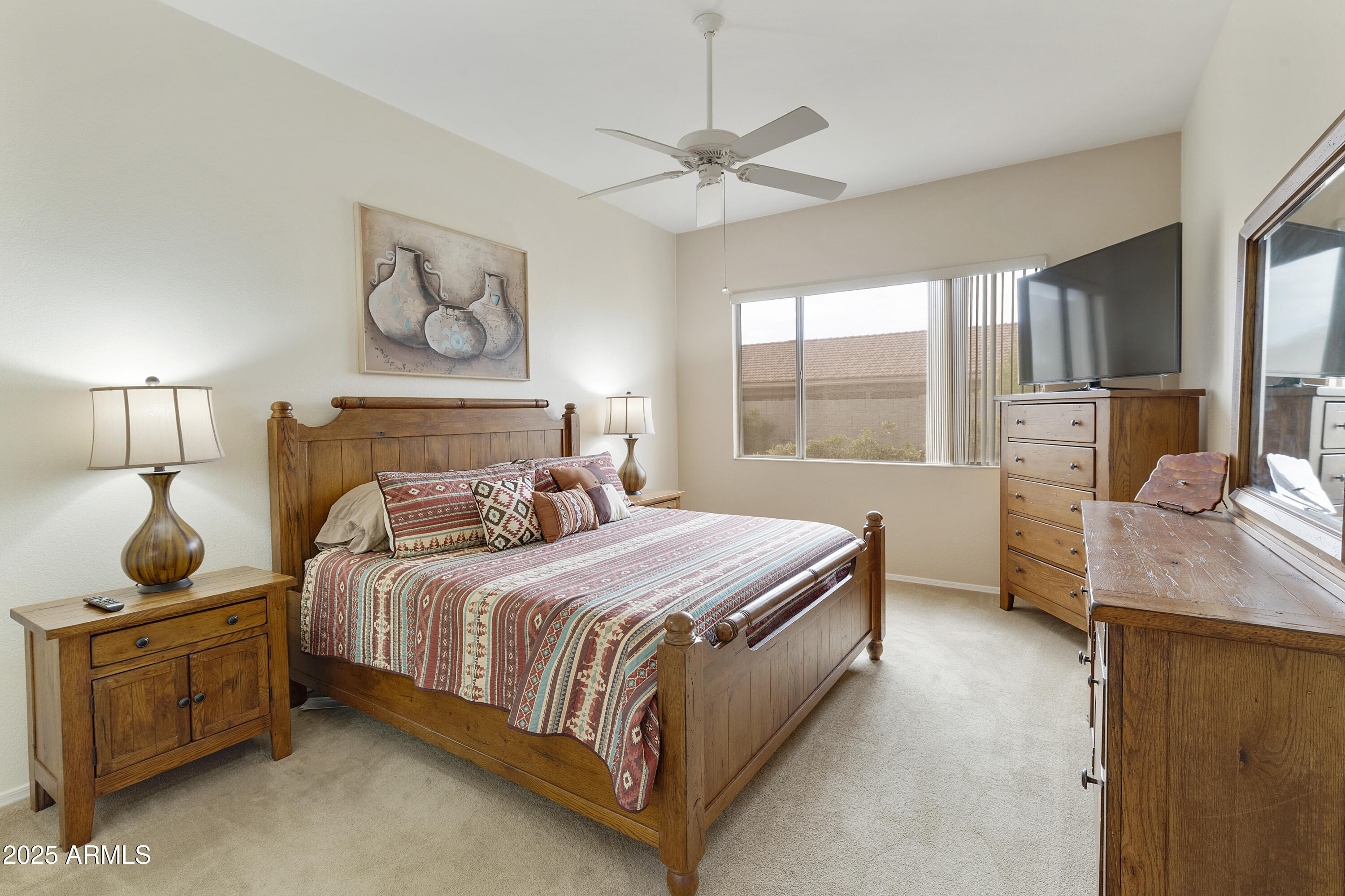 23745 South Vacation Way Sun Lakes, AZ 85248 - Photo 18 of 52 a bedroom with a bed and window