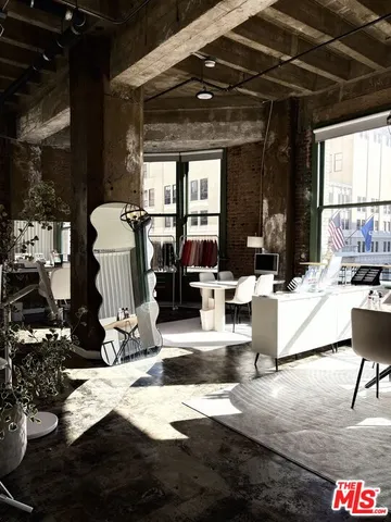 a view of a patio with dining table and chairs