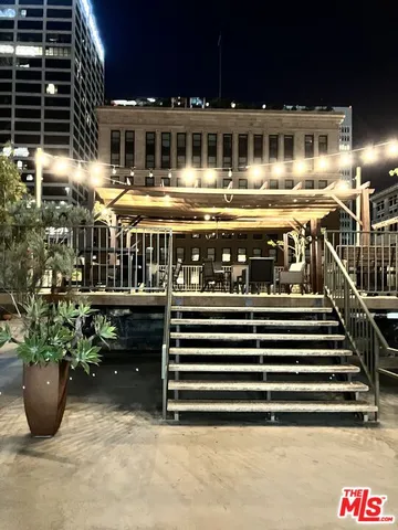 a view of a chairs and table in a patio