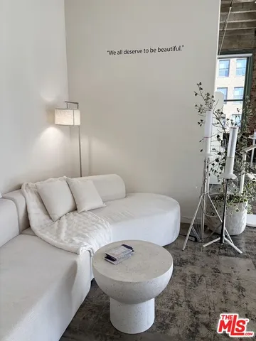 a bed room with a bed and a chandelier