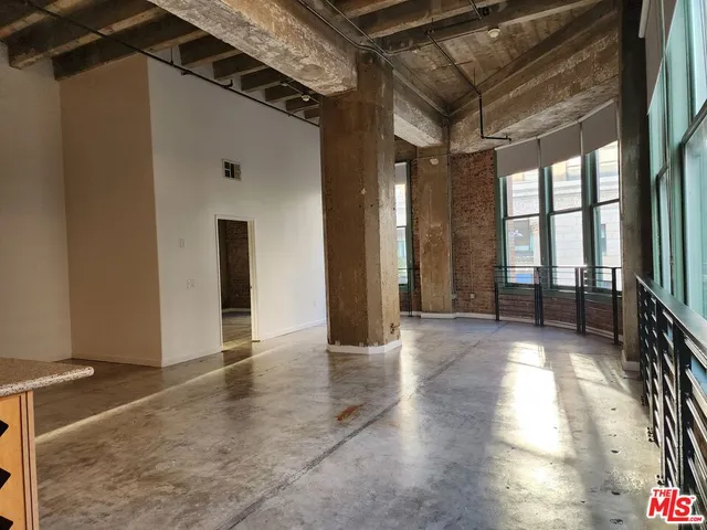 a view of gallery with wooden floor