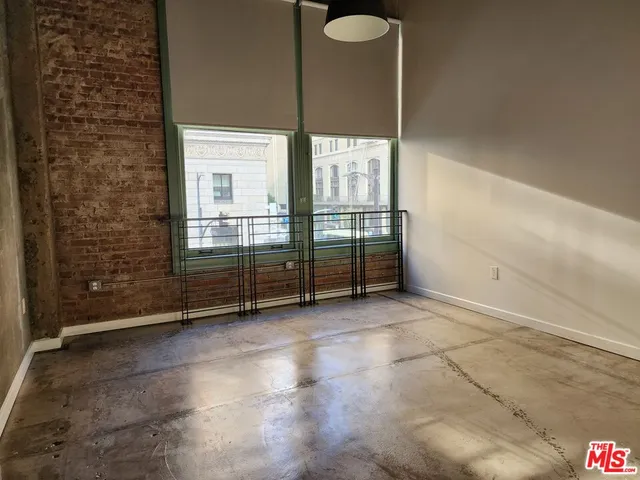 a view of empty room with windows