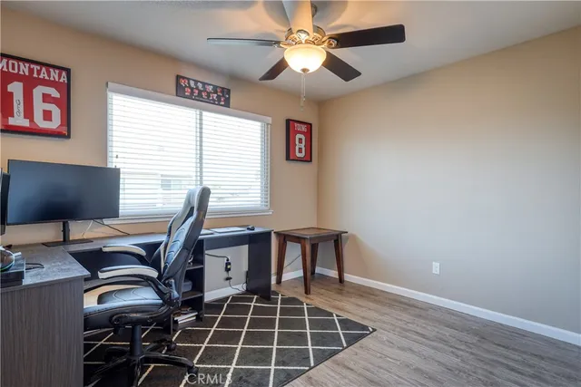 a work room with furniture and a window