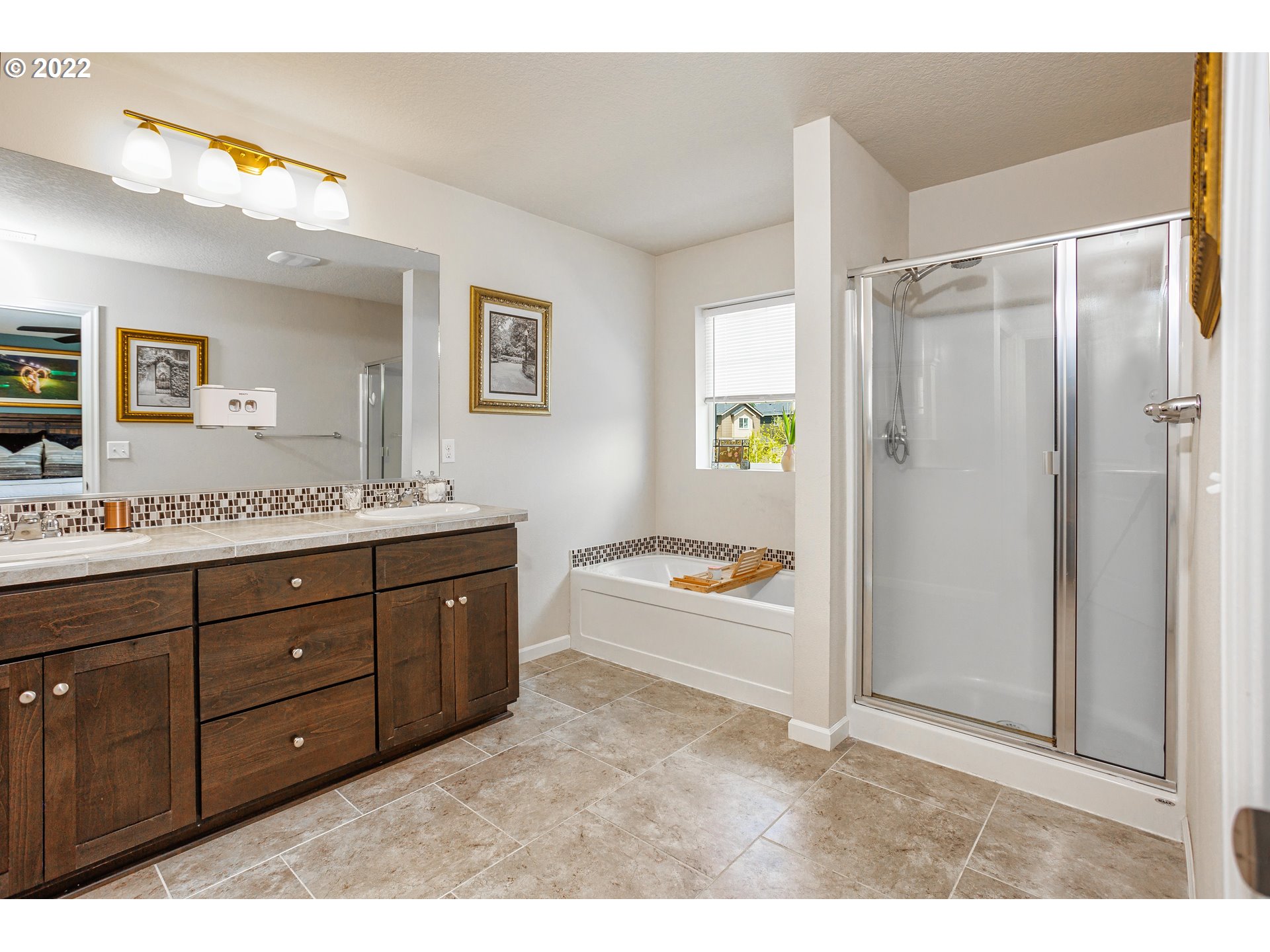 2732 South Red Tail Loop Ridgefield, WA 98642 - Photo 17 of 28 a spacious bathroom with a granite countertop sink mirror and bathtub