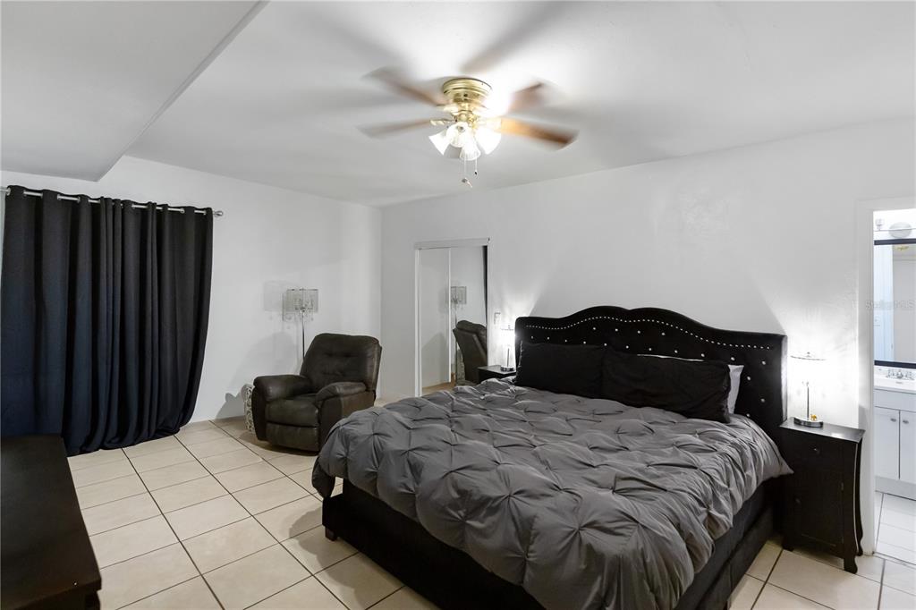 4303 Anderson Road Orlando, FL 32812 - Photo 12 of 47 a bedroom with a bed and a closet
