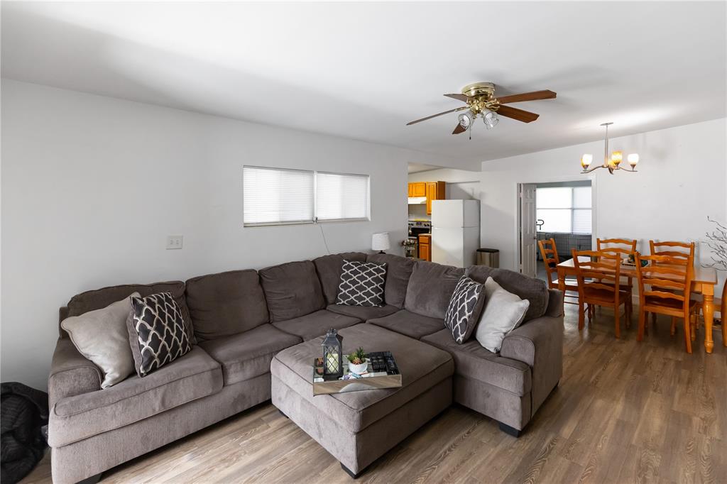 4303 Anderson Road Orlando, FL 32812 - Photo 19 of 47 a living room with furniture and wooden floor