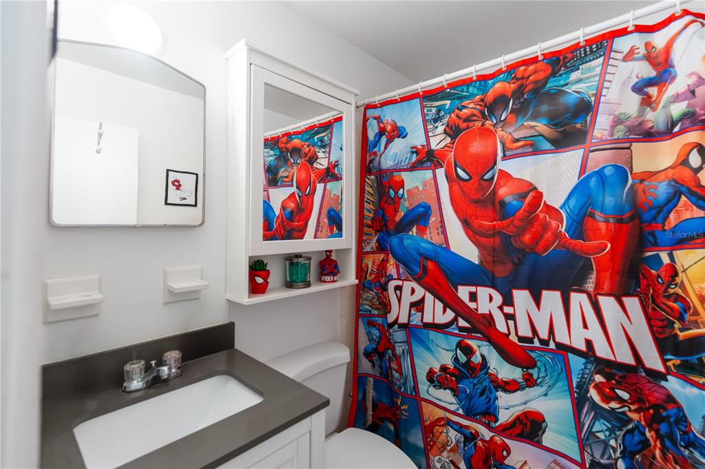 4303 Anderson Road Orlando, FL 32812 - Photo 24 of 47 a bathroom with a sink and a mirror