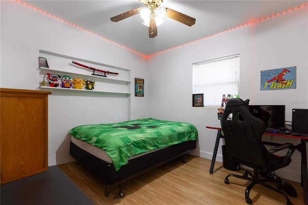 4303 Anderson Road Orlando, FL 32812 - Photo 29 of 47 a bed room with furniture and a window