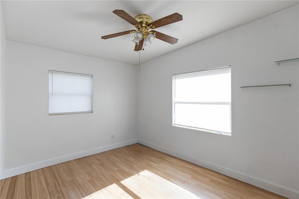 4303 Anderson Road Orlando, FL 32812 - Photo 30 of 47 an empty room with a window and a fan