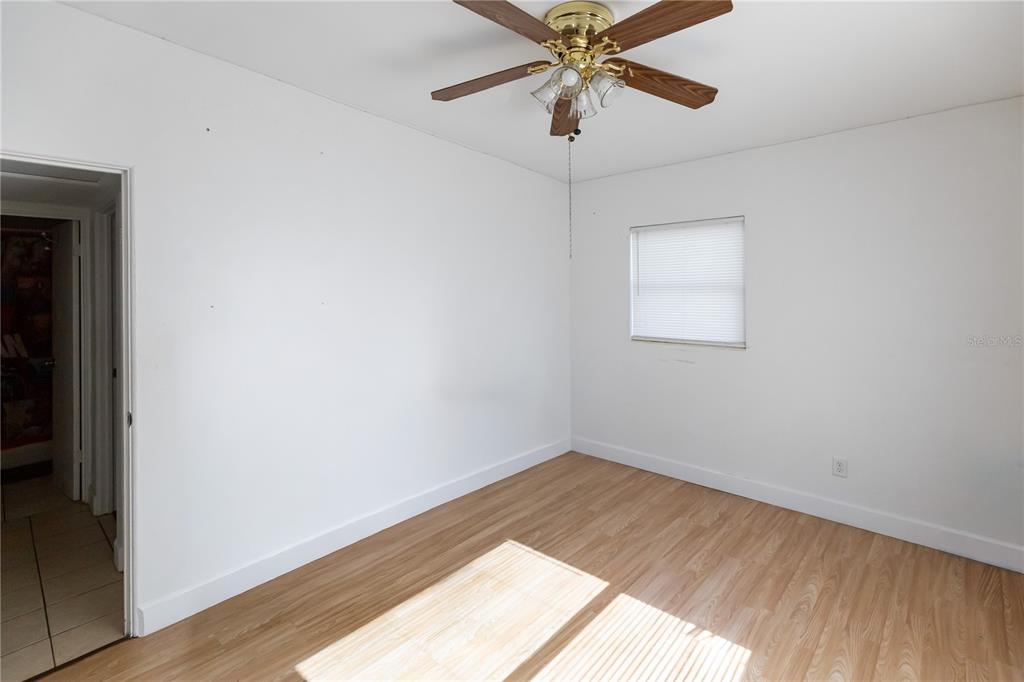 4303 Anderson Road Orlando, FL 32812 - Photo 31 of 47 an empty room with a window and a fan