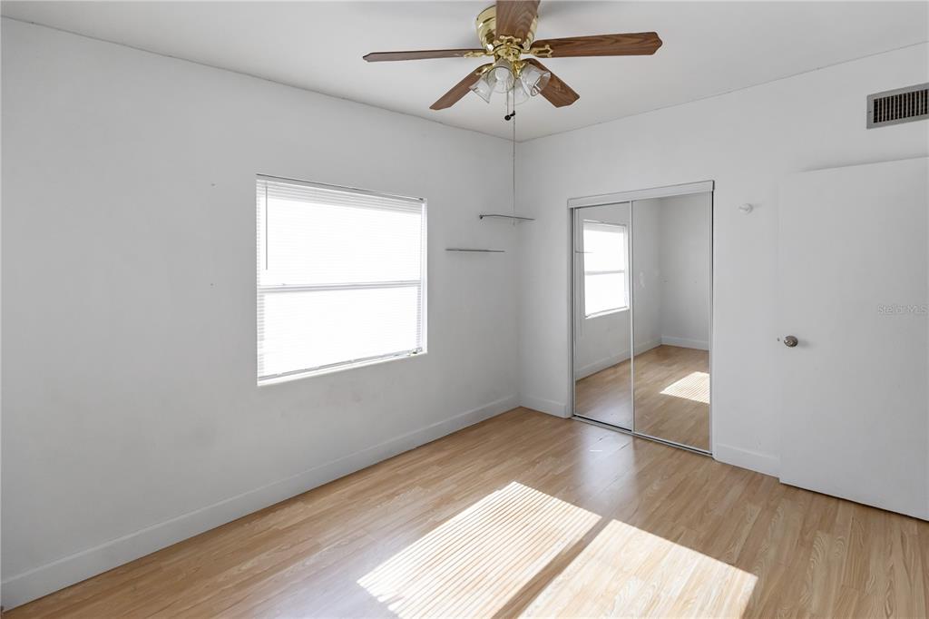 4303 Anderson Road Orlando, FL 32812 - Photo 33 of 47 wooden floor in an empty room with a window
