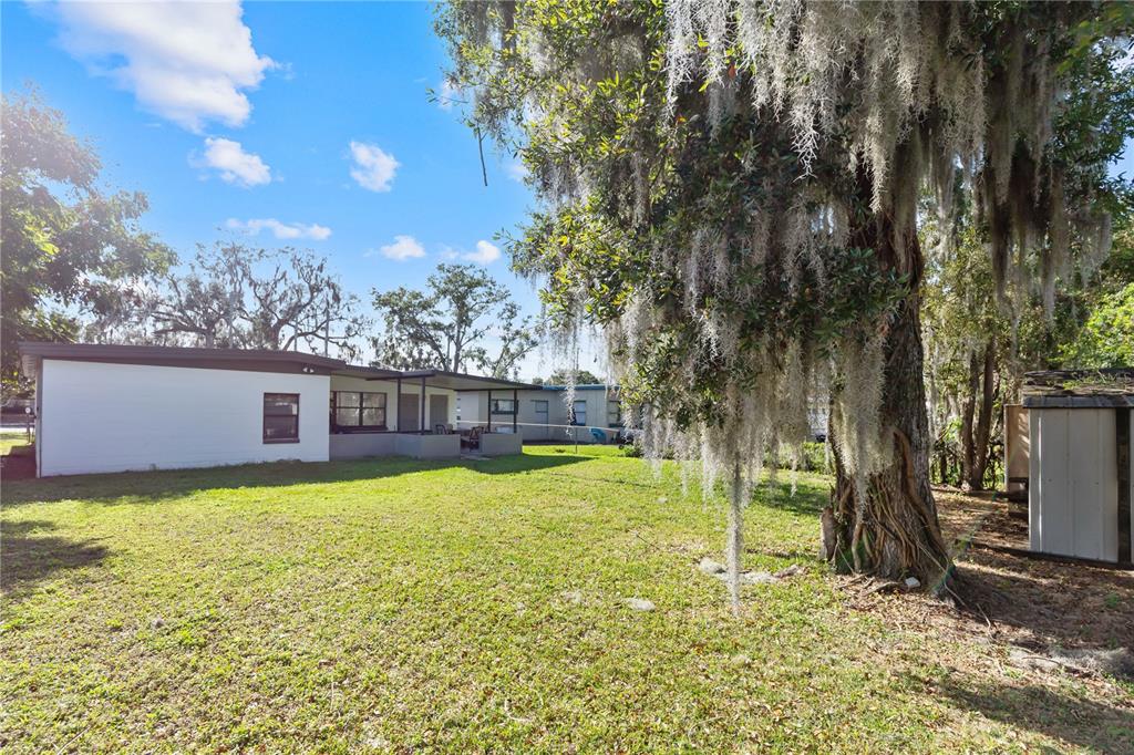 4303 Anderson Road Orlando, FL 32812 - Photo 42 of 47 a view of a house with a yard