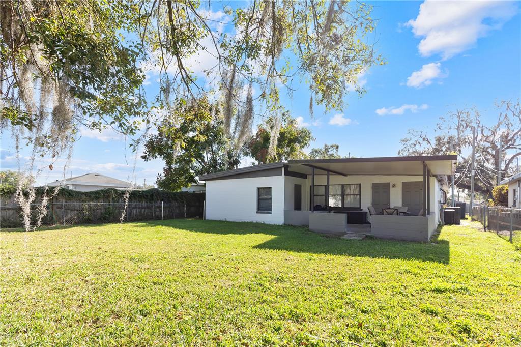 4303 Anderson Road Orlando, FL 32812 - Photo 44 of 47 a view of a house with a yard