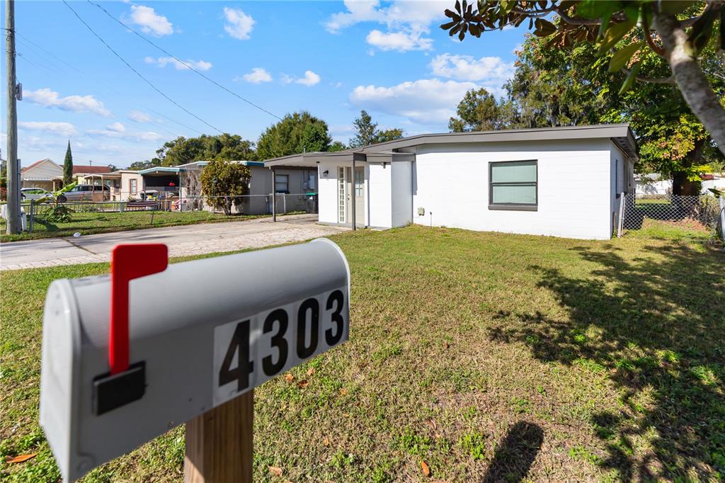 4303 Anderson Road Orlando, FL 32812 - Photo 47 of 47 a front view of a house with a yard