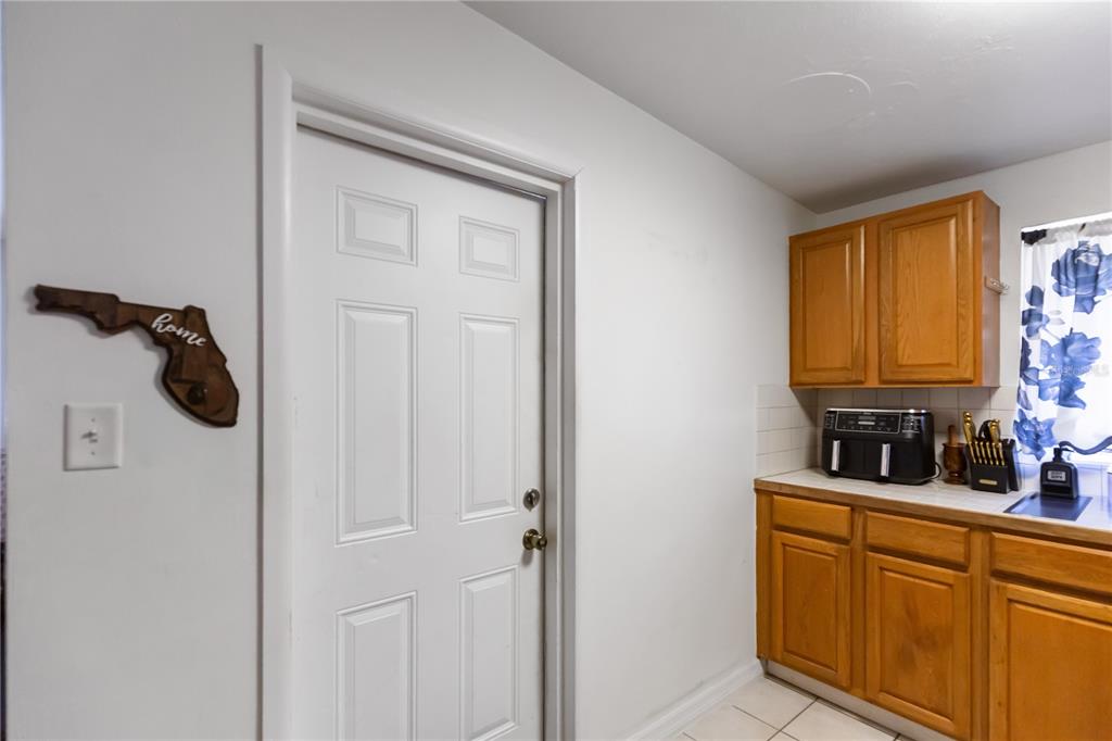 4303 Anderson Road Orlando, FL 32812 - Photo 6 of 47 a bathroom with a sink and a mirror