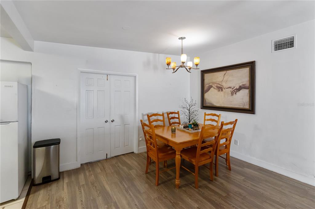 4303 Anderson Road Orlando, FL 32812 - Photo 8 of 47 a dining room with furniture and chandelier