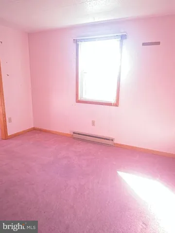 a dining room with furniture and a chandelier