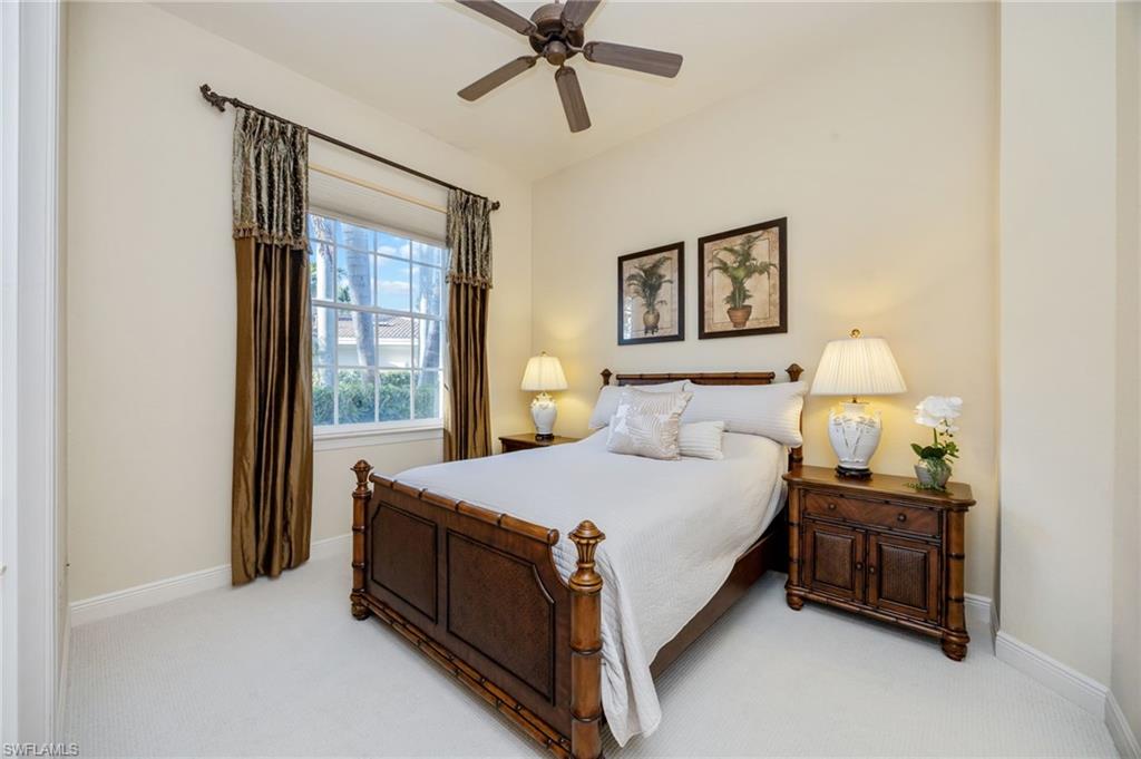 15532 Monterosso Lane, Unit 102 Naples, FL 34110 - Photo 30 of 49 a bedroom with a bed and window