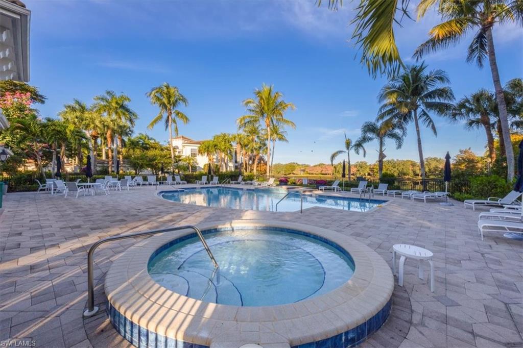 15532 Monterosso Lane, Unit 102 Naples, FL 34110 - Photo 39 of 49 a view of a swimming pool with a yard