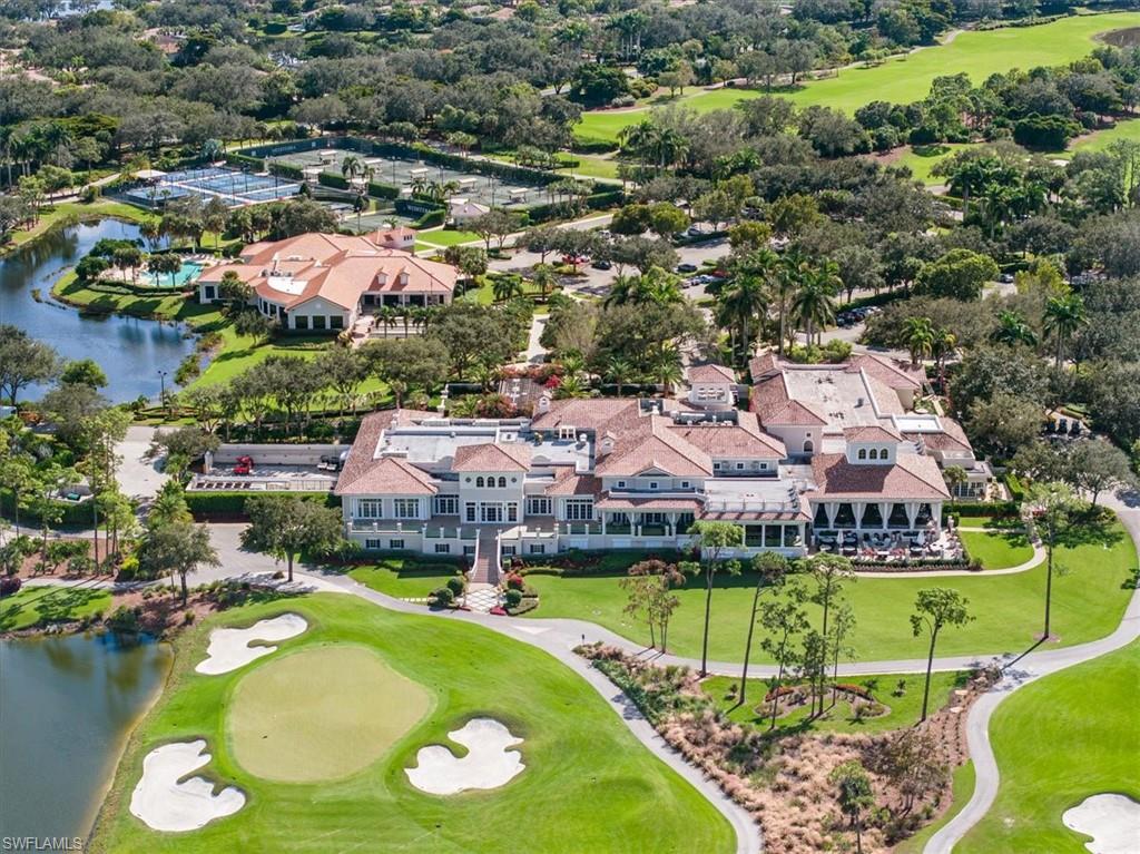 15532 Monterosso Lane, Unit 102 Naples, FL 34110 - Photo 41 of 49 an aerial view of a house with a garden and lake view