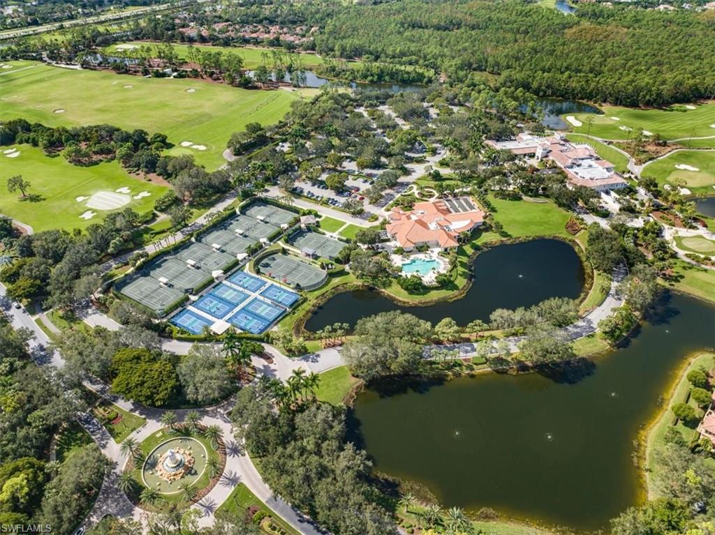 15532 Monterosso Lane, Unit 102 Naples, FL 34110 - Photo 43 of 49 an aerial view of residential houses with outdoor space and lake view