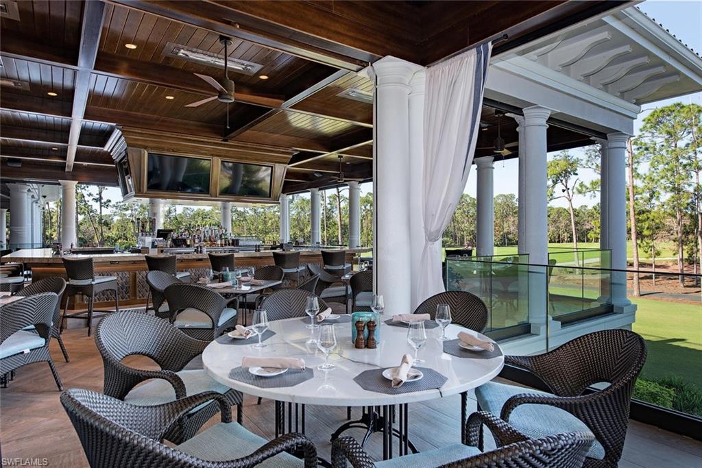 15532 Monterosso Lane, Unit 102 Naples, FL 34110 - Photo 48 of 49 a view of a dining room with furniture window and outside view
