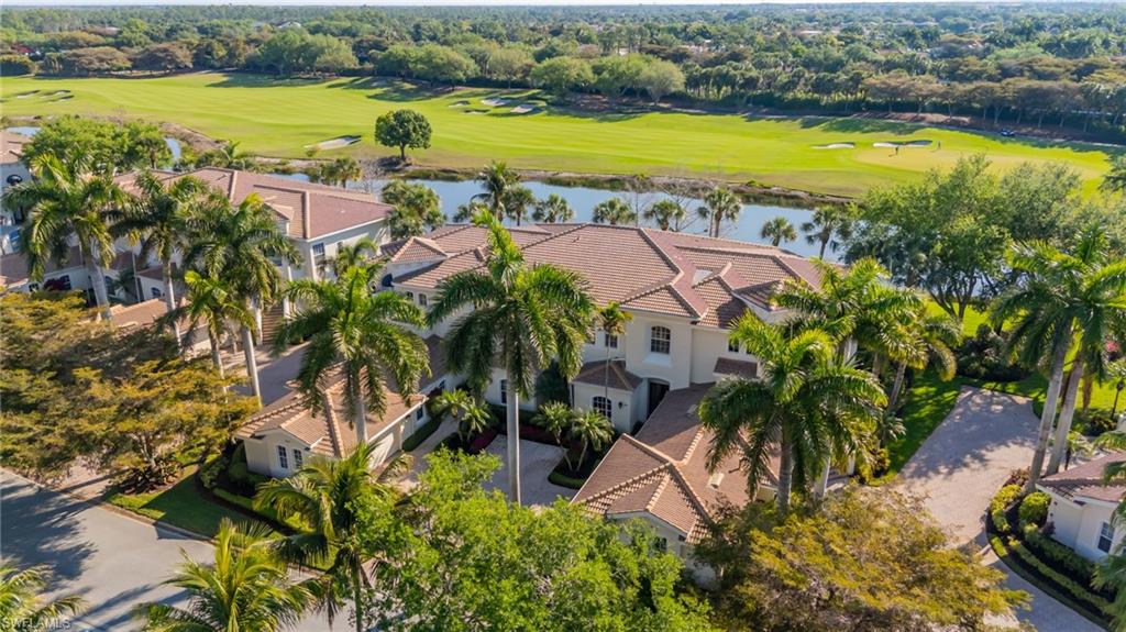 15532 Monterosso Lane, Unit 102 Naples, FL 34110 - Photo 6 of 49 an aerial view of residential houses with outdoor space and swimming pool
