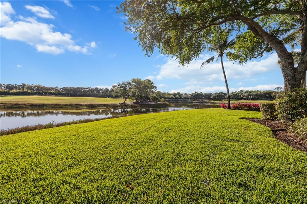 15532 Monterosso Lane, Unit 102 Naples, FL 34110 - Photo 8 of 49 a view of a lake with a big yard