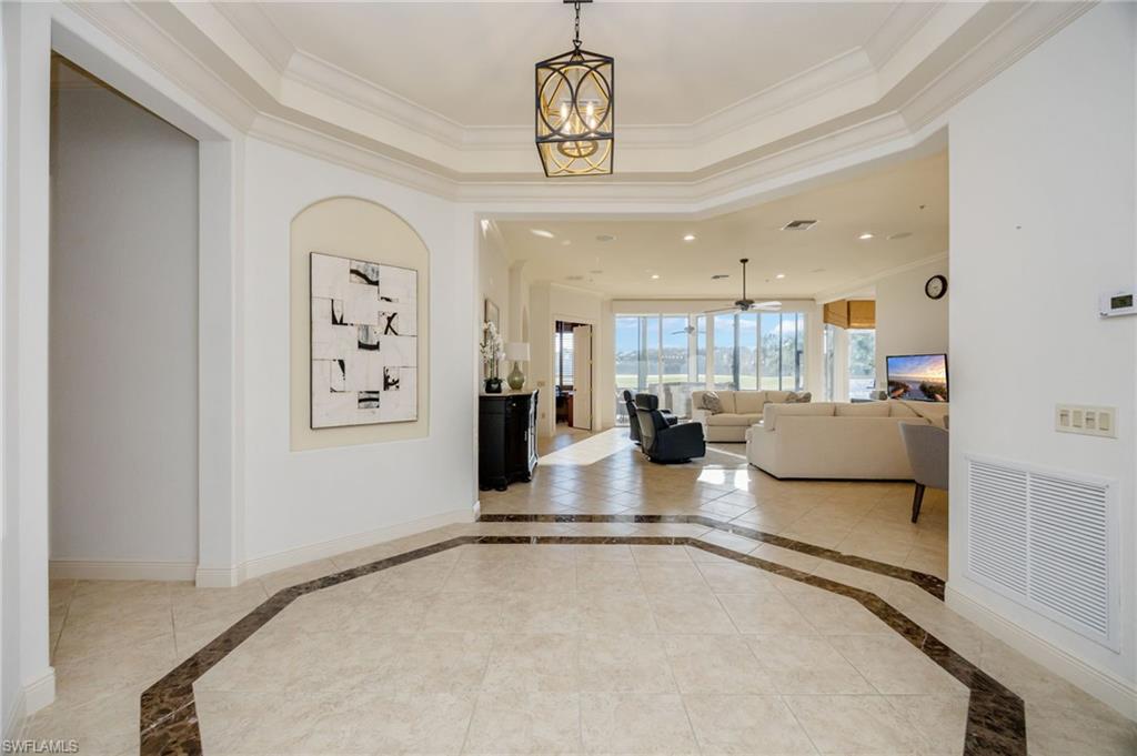 15532 Monterosso Lane, Unit 102 Naples, FL 34110 - Photo 9 of 49 a view of a living room and kitchen view