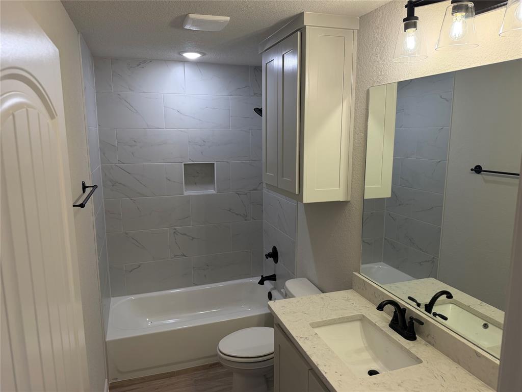 2998 Knob Road Springtown, TX 76082 - Photo 7 of 7 a bathroom with a sink toilet and shower