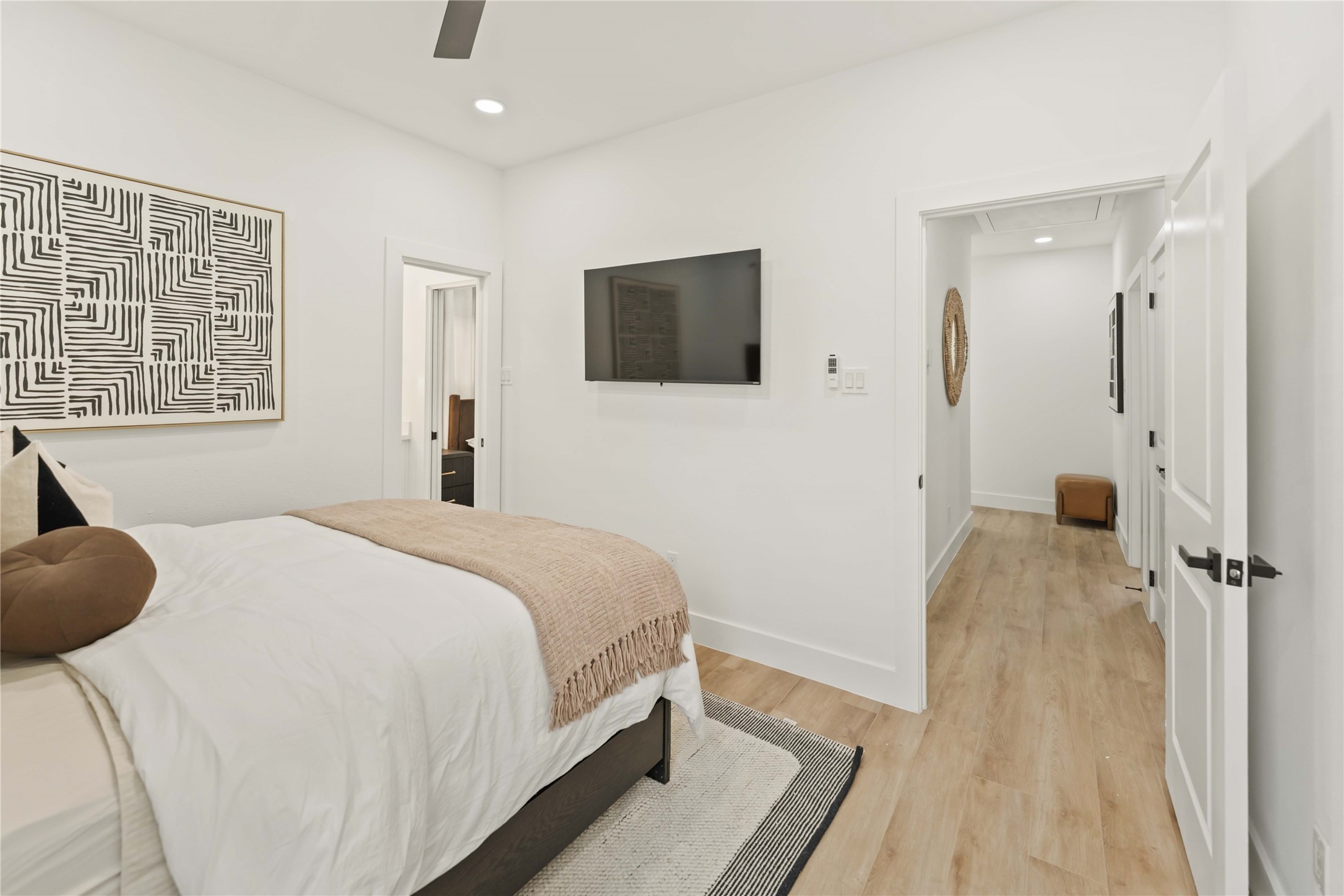 6539 Sealey Street Houston, TX 77091 - Photo 27 of 28 a bedroom with a bed and a television