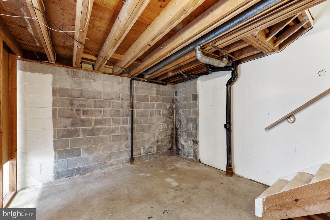 8488 Stonewall Road Manassas, VA 20110 - Photo 34 of 43 Unfinished space at base of stairs