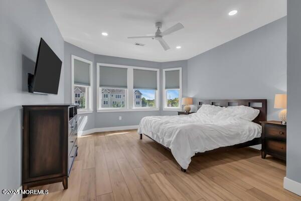 22 Cooper Avenue, Unit 202 Long Branch, NJ 07740 - Photo 15 of 38 a spacious bedroom with a bed and a flat screen tv