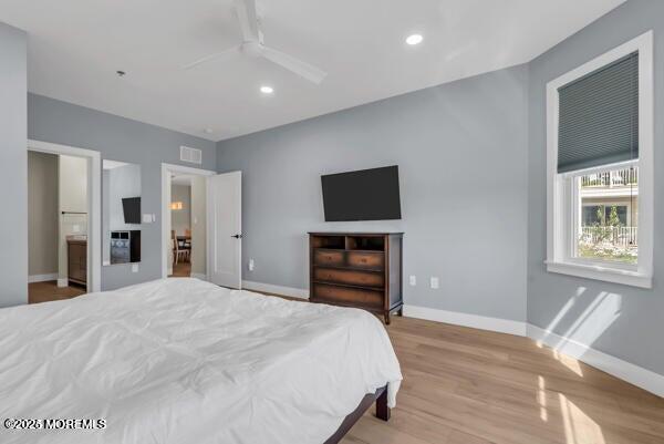 22 Cooper Avenue, Unit 202 Long Branch, NJ 07740 - Photo 17 of 38 a bedroom with a bed and a flat screen tv