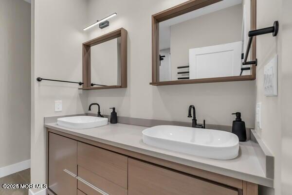 22 Cooper Avenue, Unit 202 Long Branch, NJ 07740 - Photo 18 of 38 a bathroom with a sink and a mirror