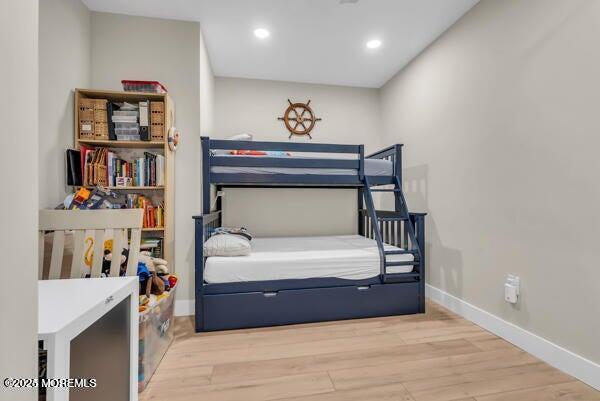 22 Cooper Avenue, Unit 202 Long Branch, NJ 07740 - Photo 25 of 38 a bedroom with a bed and a book shelf