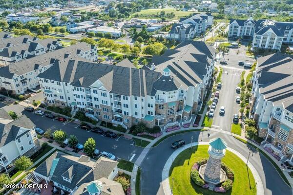 22 Cooper Avenue, Unit 202 Long Branch, NJ 07740 - Photo 32 of 38 aerial view of a swimming pool with outdoor seating and plants