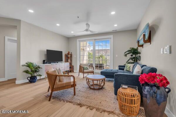 22 Cooper Avenue, Unit 202 Long Branch, NJ 07740 - Photo 4 of 38 a living room with furniture and a flat screen tv