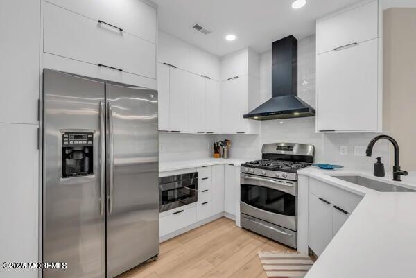 22 Cooper Avenue, Unit 202 Long Branch, NJ 07740 - Photo 9 of 38 a kitchen with stainless steel appliances granite countertop a stove a refrigerator and a sink