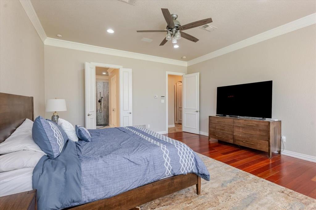 166 East Rio Ridge Azle, TX 76020 - Photo 19 of 40 a bedroom with a bed and a flat screen television