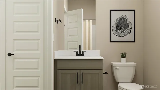 a bedroom with a bed and a night stand